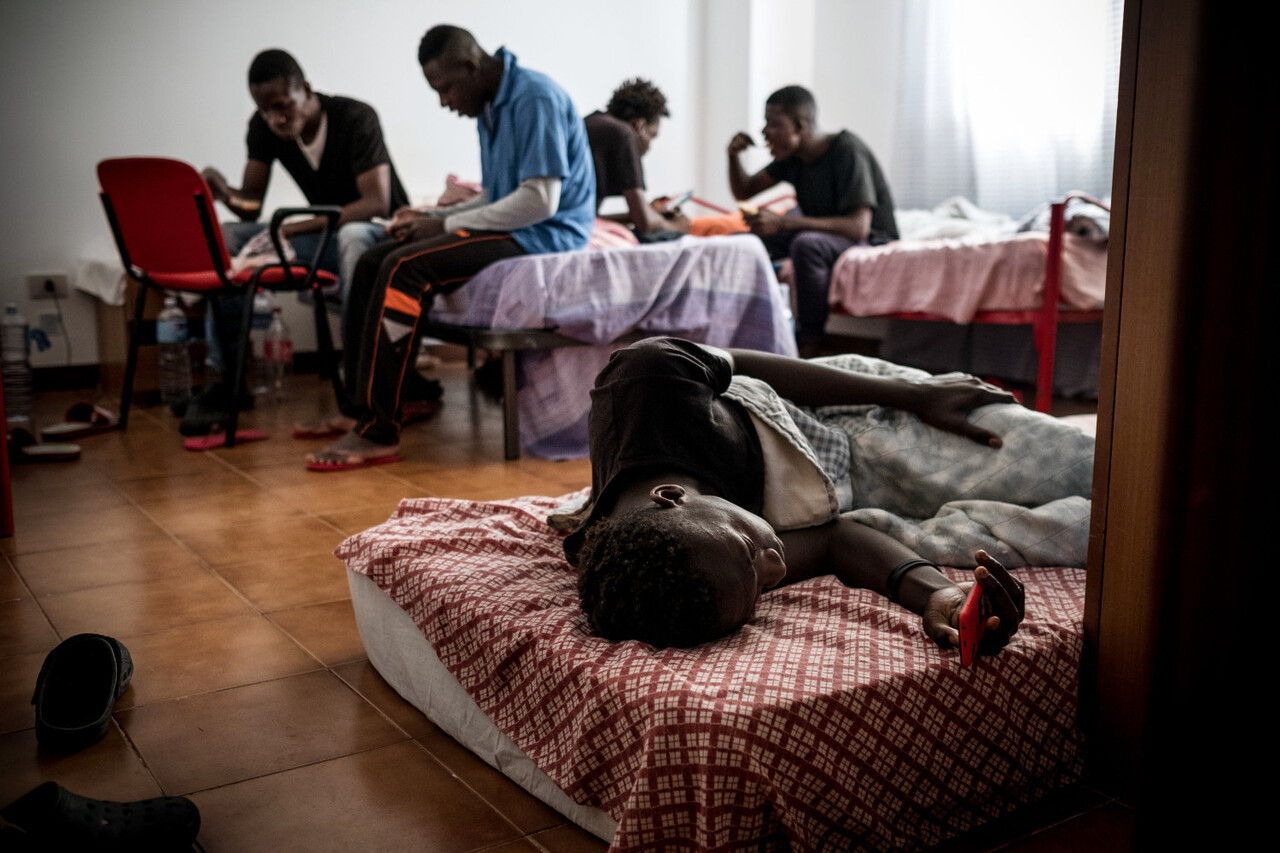 A boy lies on a bed while others are seen behind, in their room at an unaccompanied minor shelter in Trabia, Italy, on May 19, 2016. The boys live at Rainbow, a government administered center for unaccompanied boys that provides shelter, food, education and legal help for unaccompanied asylum seekers in Trabia, Sicily. Of the 150,000 migrants and refugees who arrived in Italy in 2015, the vast majority of people are coming from West Africa. In May 2016, since the beginning of 2016, almost 184,500 people have crossed the Mediterranean to seek safety and protection in Europe. Following the significant change in the situation in south-eastern Europe, UNICEF is revising its funding needs and programmatic response to adapt to the needs of refugee and migrant children in Greece, Turkey, Italy and other European countries. One of the main challenges in the current situation is reaching invisible refugee and migrant children, taking dangerous illegal routes and facing heightened risks of abuse, exploitation and trafficking.