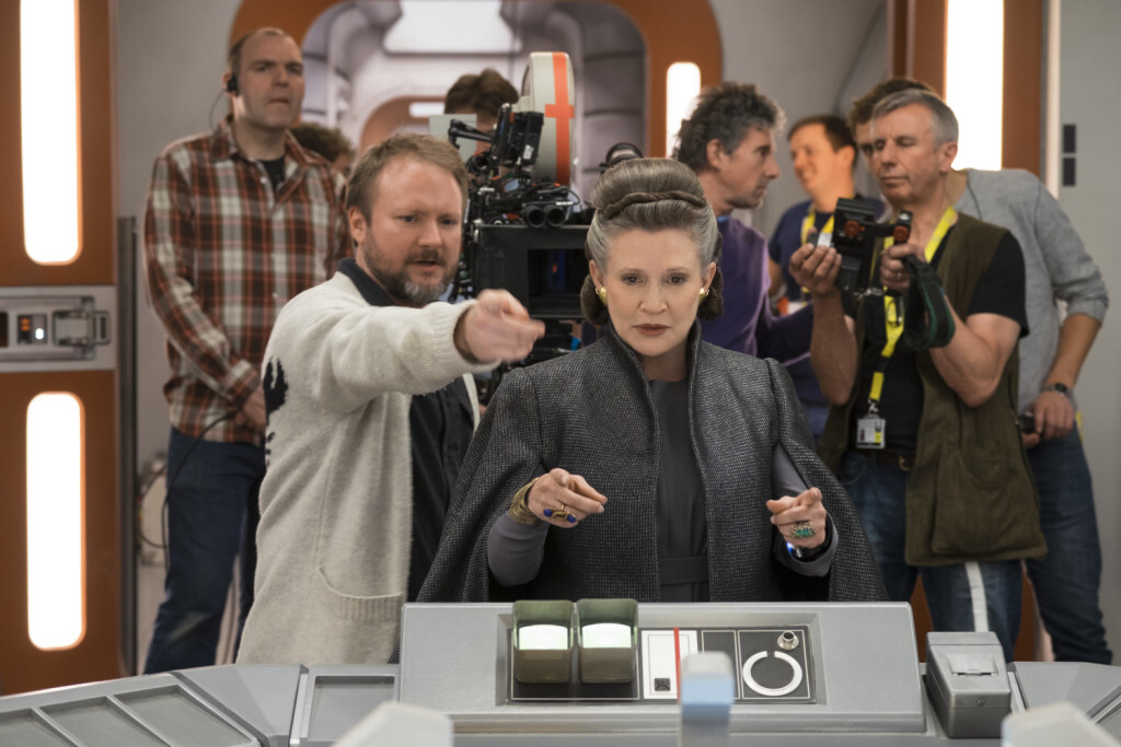 Star Wars: The Last Jedi..L to R: Director Rian Johnson with Carrie Fisher (Leia) on set. ..Photo: David James..©2017 Lucasfilm Ltd. All Rights Reserved.